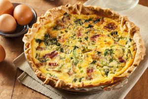 Homemade Spinach and Bacon Egg Quiche in a pie crust